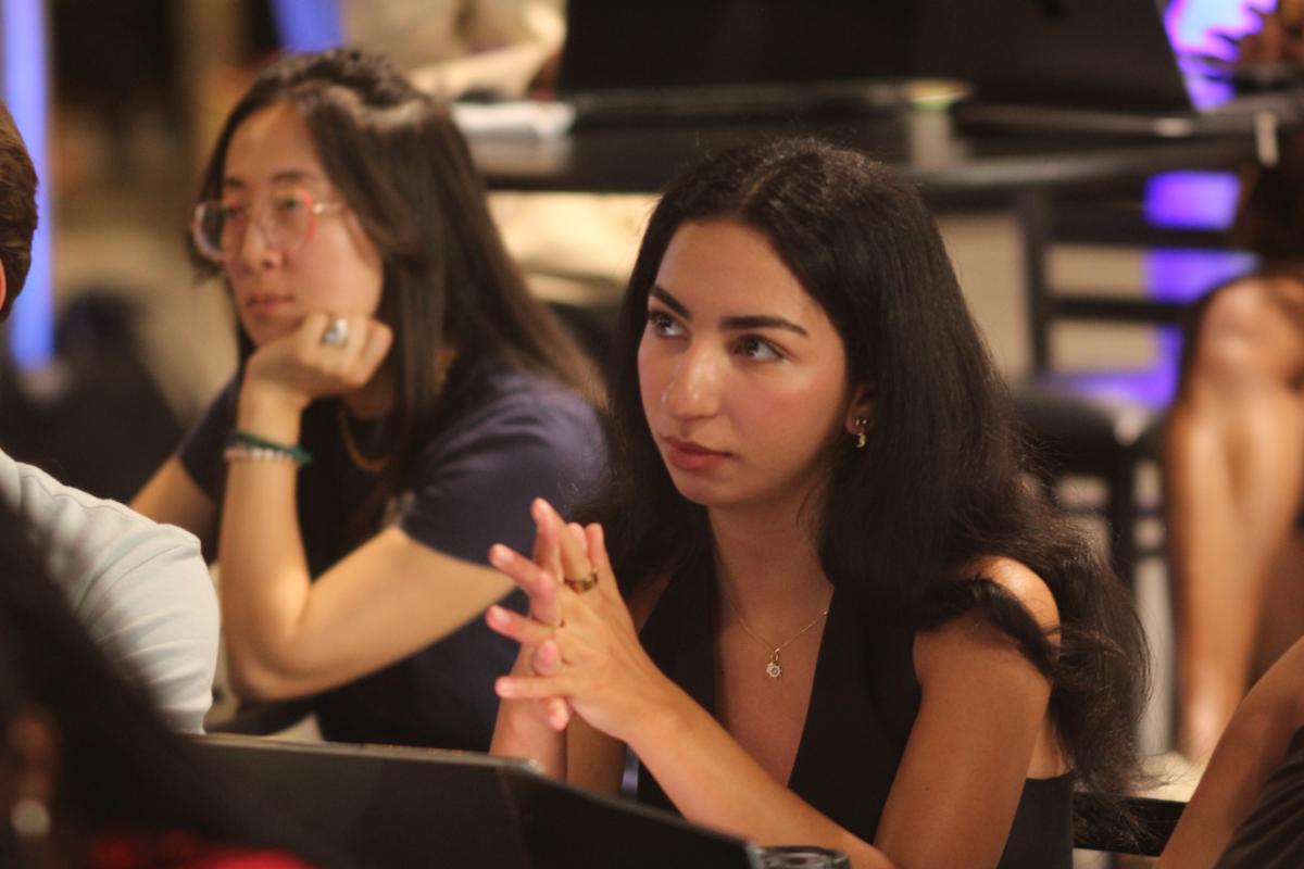 Participants listen attentively during a presentation or discussion session at a Georgia Tech innovation event.